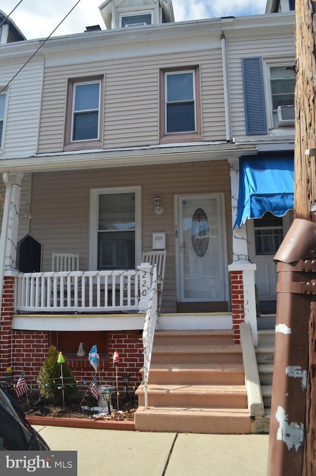 view of property with covered porch