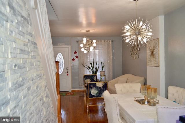 dining room featuring dark hardwood / wood-style floors and a notable chandelier