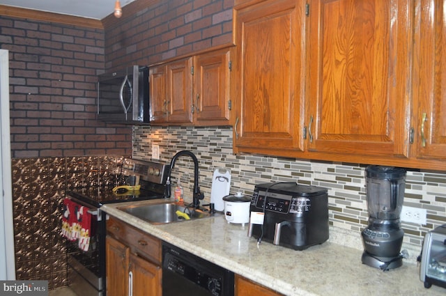 kitchen with backsplash, sink, brick wall, and appliances with stainless steel finishes