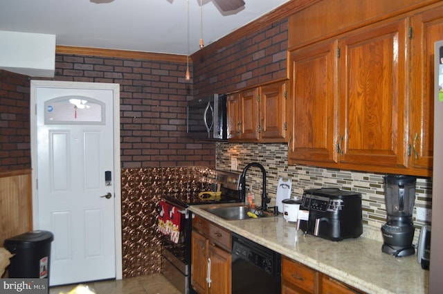 kitchen featuring brick wall, black dishwasher, sink, and decorative backsplash