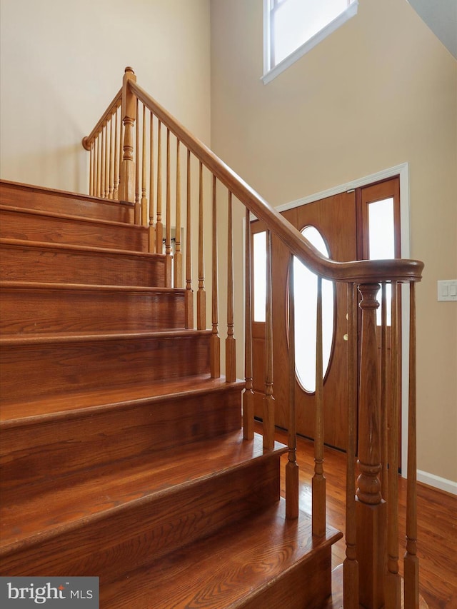 stairway featuring wood finished floors