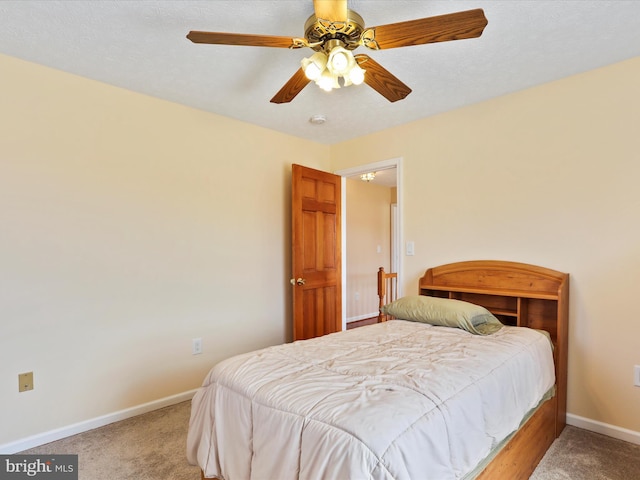 bedroom with carpet floors, baseboards, and a ceiling fan