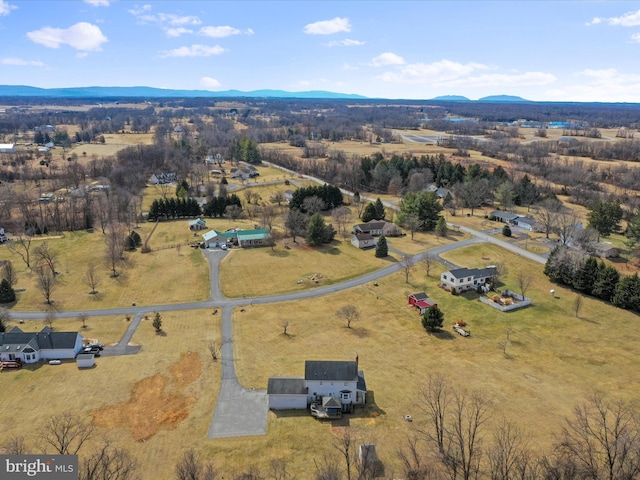 drone / aerial view featuring a rural view and a mountain view