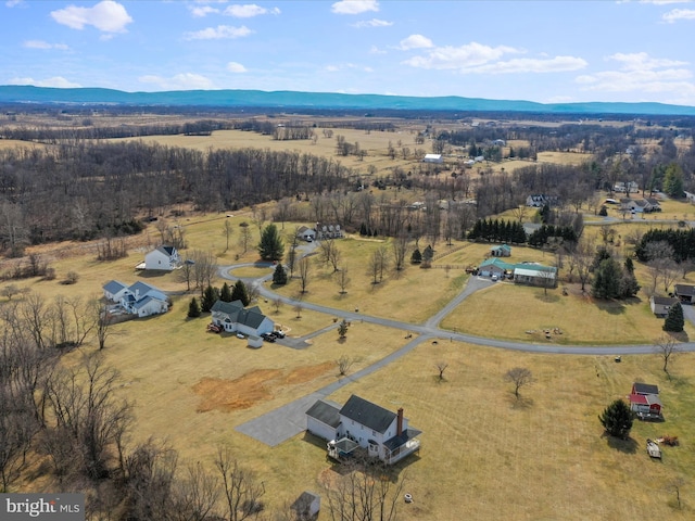 bird's eye view featuring a rural view and a mountain view