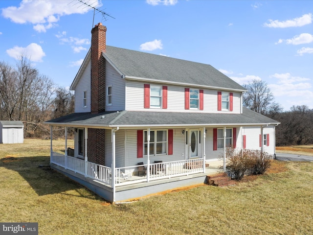 country-style home with a chimney, a front lawn, a porch, and roof with shingles