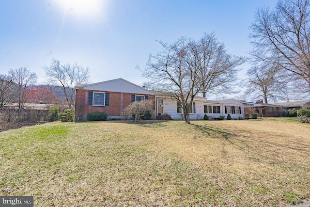 ranch-style house with a front lawn