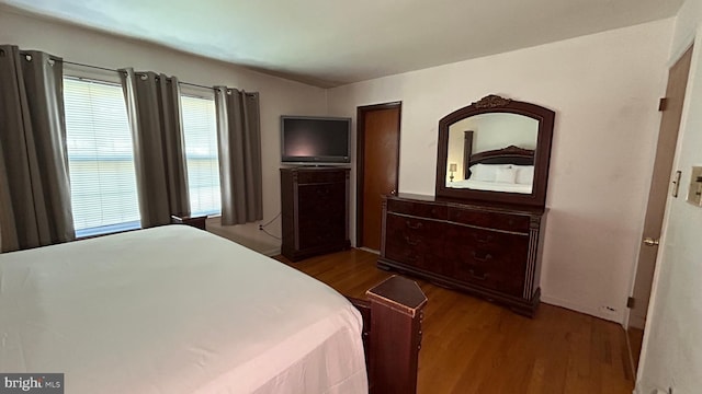 bedroom with wood finished floors