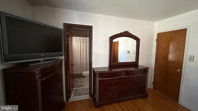 bedroom featuring wood finished floors