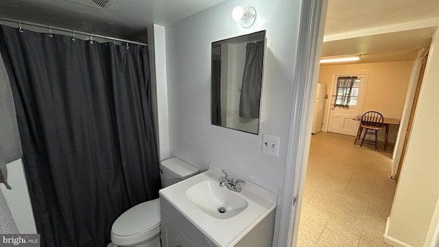 full bath featuring tile patterned floors, vanity, and toilet