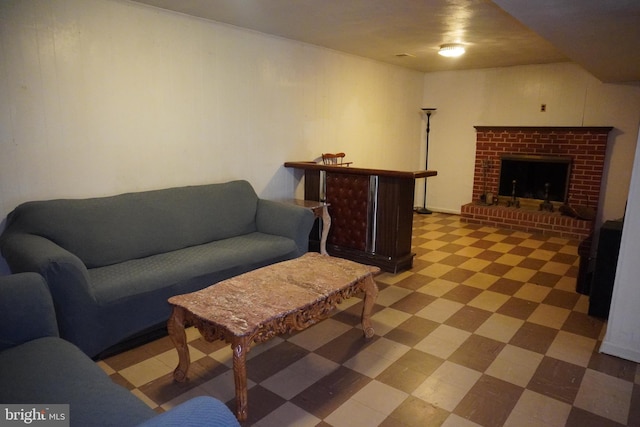 living room featuring tile patterned floors and a fireplace