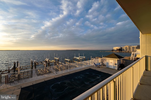 balcony at dusk with a water view