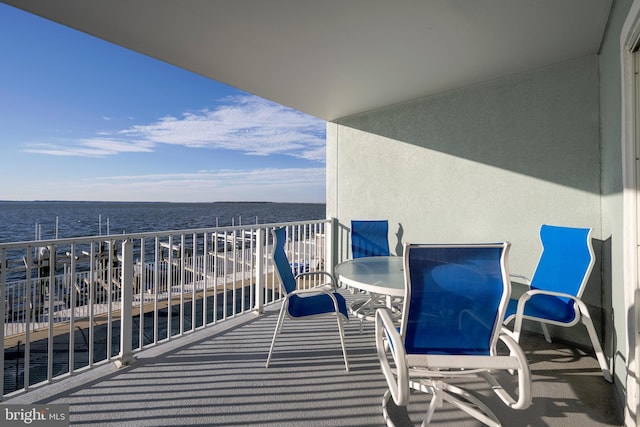 balcony featuring a water view