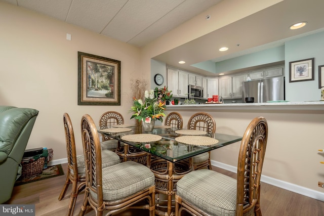 dining space featuring hardwood / wood-style flooring