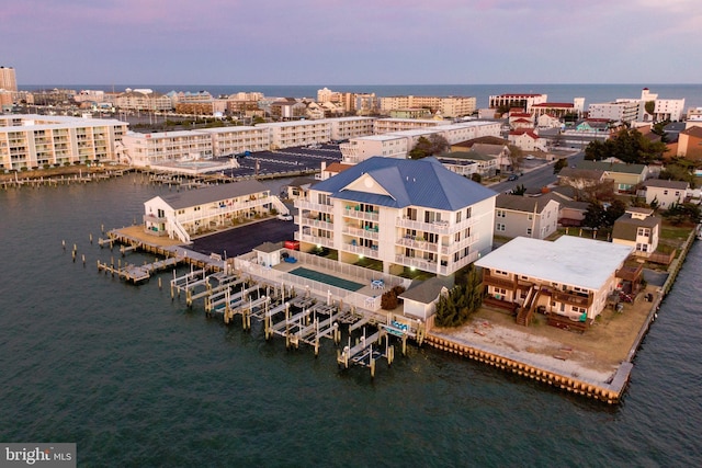 birds eye view of property featuring a water view