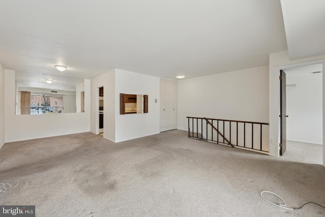 spare room featuring carpet floors