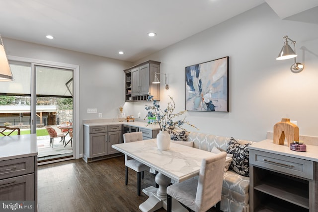 dining area with dark wood-style floors and recessed lighting