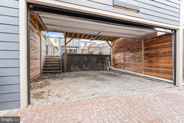 view of parking / parking lot featuring driveway and an attached carport