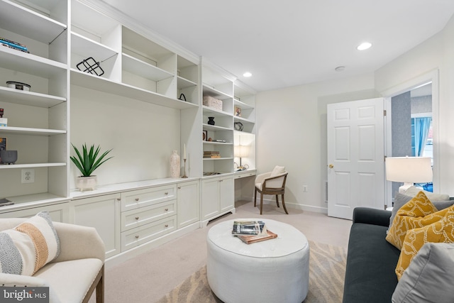 living area featuring recessed lighting, light colored carpet, and baseboards