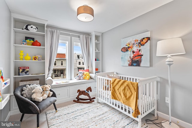 carpeted bedroom with baseboards