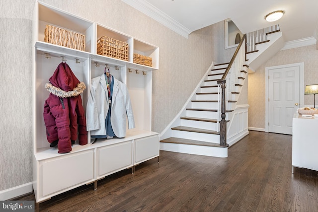 mudroom with crown molding, baseboards, dark wood-style floors, and wallpapered walls