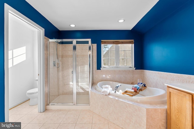 bathroom featuring independent shower and bath, tile patterned floors, and toilet