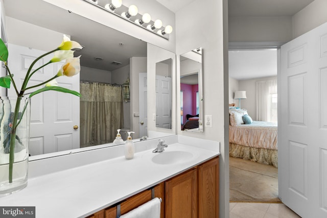 bathroom with vanity and tile patterned floors