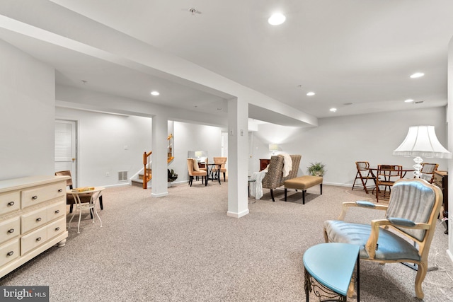 living area featuring light colored carpet