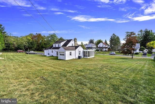 view of yard with central AC unit