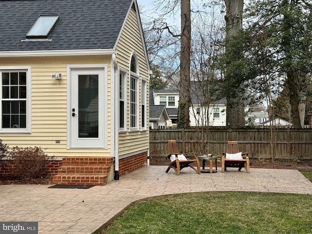 view of patio / terrace featuring fence