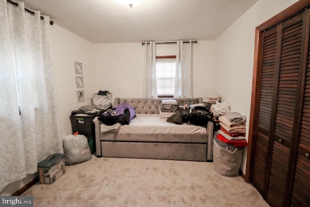 carpeted bedroom with a closet