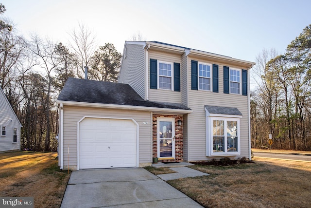 view of front facade featuring a garage and a front lawn