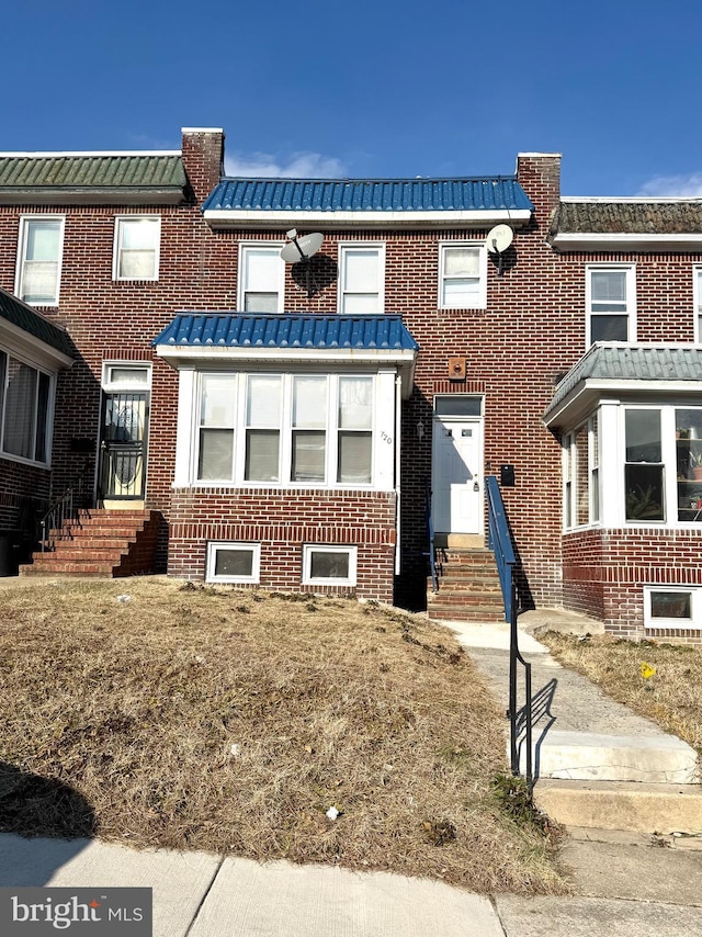 view of property featuring a front yard