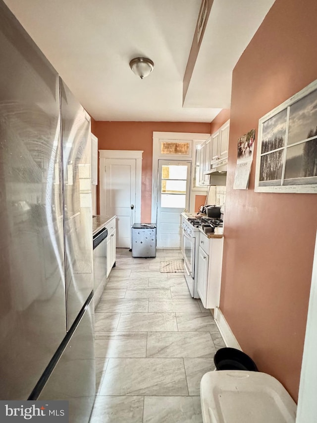 kitchen with stainless steel appliances and white cabinets