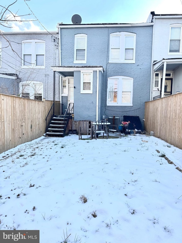 view of snow covered property