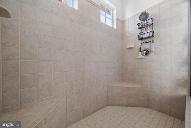 bathroom with tiled shower