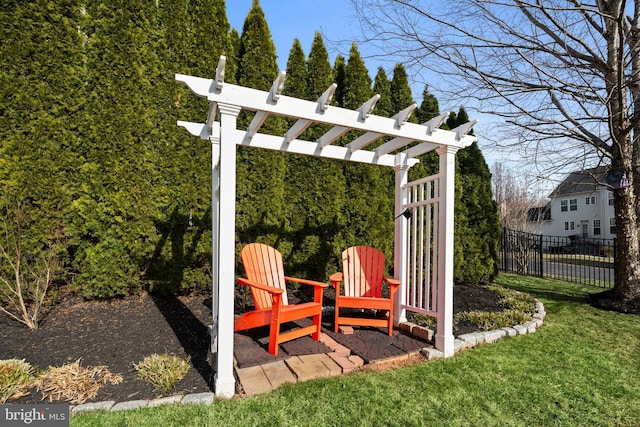 view of yard featuring fence and a pergola