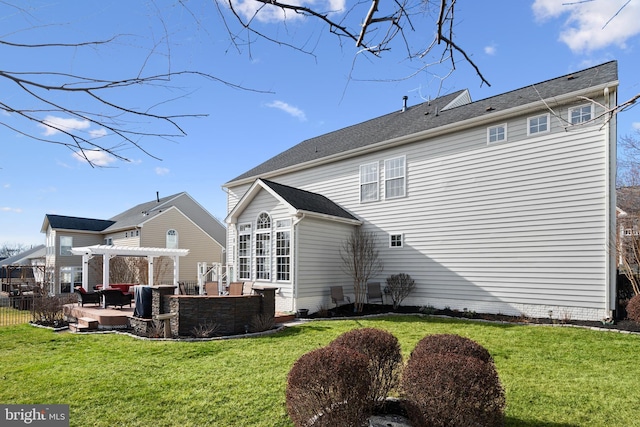 back of house featuring a patio area, a pergola, a yard, and fence