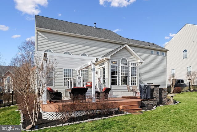 back of house with a yard, fence, a wooden deck, and a pergola