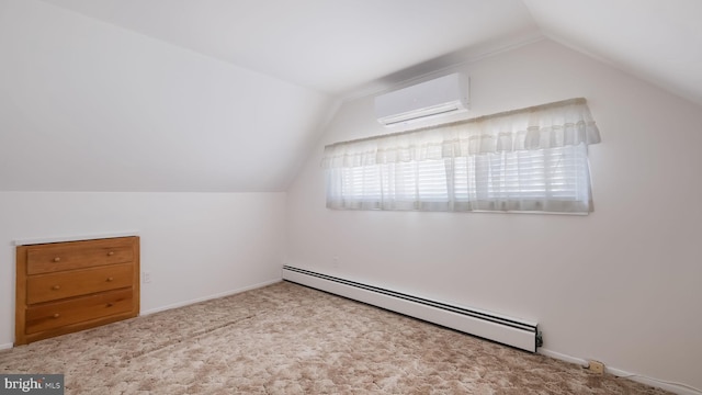 additional living space with light colored carpet, an AC wall unit, vaulted ceiling, and a baseboard heating unit