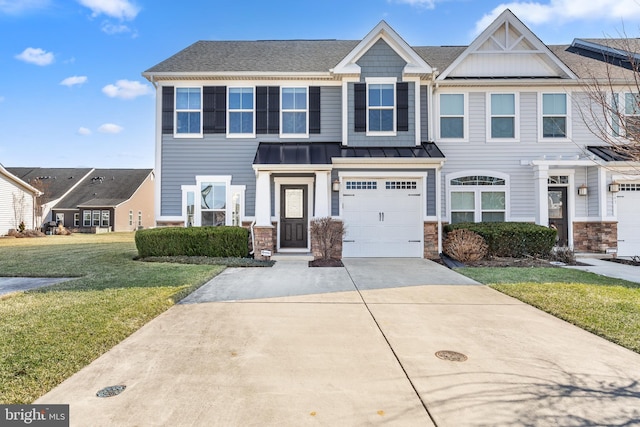 townhome / multi-family property featuring a garage and a front yard