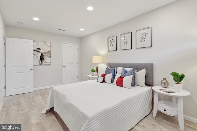 bedroom with light hardwood / wood-style floors