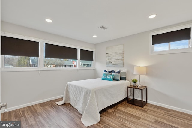 bedroom with hardwood / wood-style floors