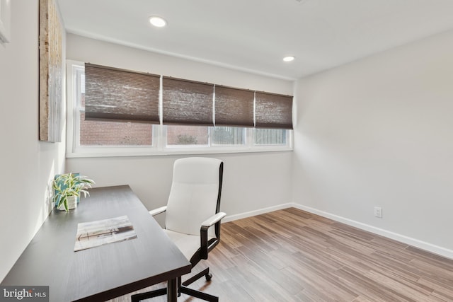 office space with light hardwood / wood-style flooring