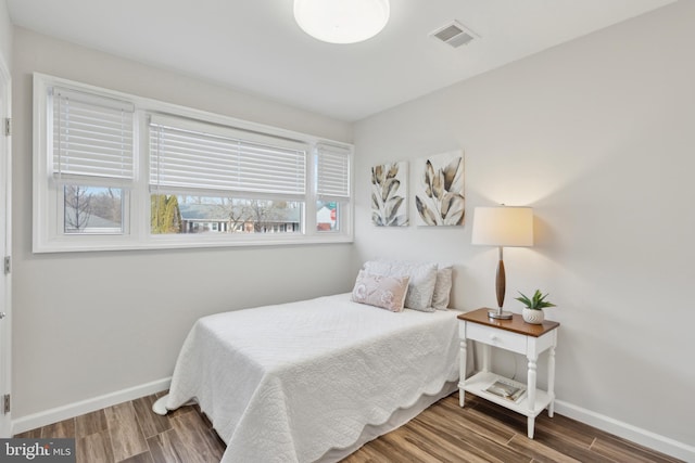 bedroom with wood-type flooring