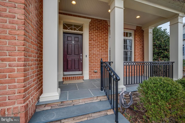 doorway to property featuring covered porch