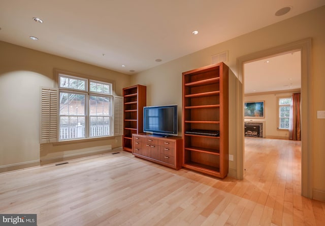 unfurnished living room with light hardwood / wood-style flooring