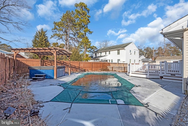 view of swimming pool with a patio, a deck, a pergola, and a hot tub