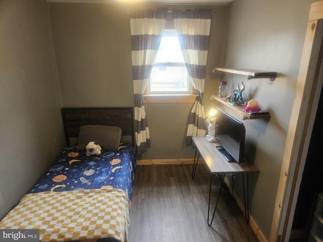 bedroom featuring dark wood-type flooring