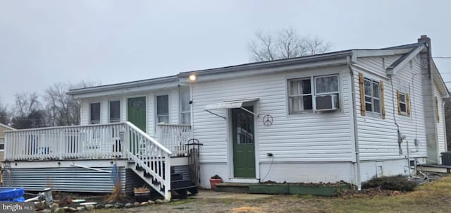 rear view of house with a wooden deck