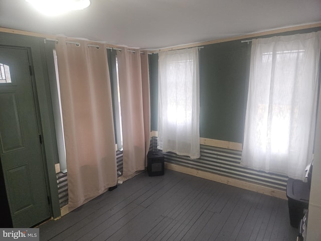 empty room featuring dark hardwood / wood-style flooring